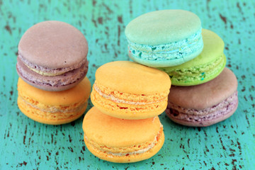 Macaroons on wooden table close-up