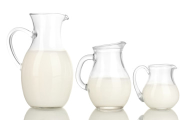 Milk in jugs isolated on white