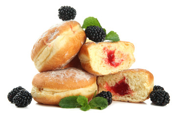 Tasty donuts with berries, isolated on white