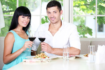 Beautiful young couple at restaurant