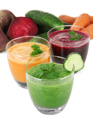 Fresh vegetable juices isolated on white