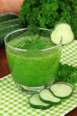 Green vegetable juice on table close-up