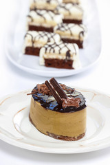 Cappuccino cake on white plate. Selective focus
