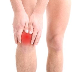 Young man with knee pain, isolated on white