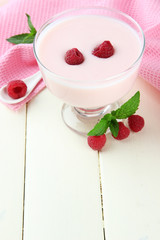 Delicious yogurt with berries on table close-up