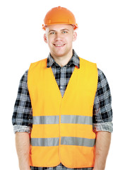 Smiling male construction worker in safety vest and hard hat