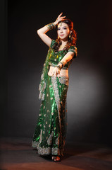 Naklejka na ściany i meble beautiful female wearing traditional indian costume