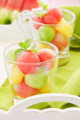 The dessert salad of watermelon and cantaloupe with honey.