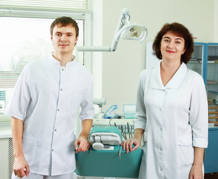 A medical doctors standing in dentist office