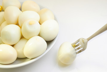 hard boiled eggs with fork