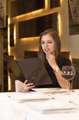 the nice girl chooses what to eat . photo