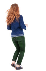 back view of jumping  woman  in  jeans.