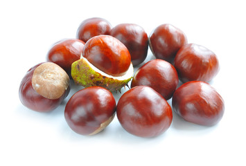 Chestnuts with crust on a white background