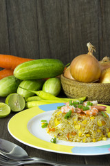 Fried rice with shrimp on the wood table
