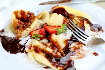 pancakes with chocolate and strawberries