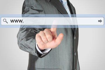 Businessman pushing virtual search bar on grey background