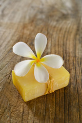 Obraz na płótnie Canvas frangipani flower with soap on wood