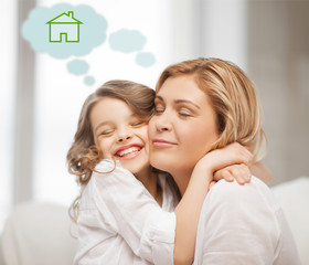 mother and daughter with eco house