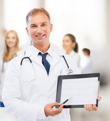 male doctor with stethoscope showing cardiogram