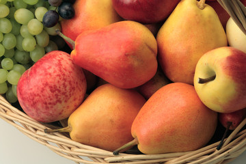 Naklejka na ściany i meble Wicker basket of grapes, apples and pears