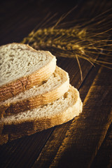 Bread slices, wheat ears and grains