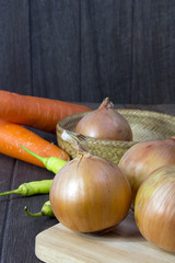 set fresh vegetables with green leaf on a wooden floor.