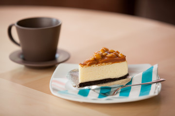 Coffee cup and a plate with cake