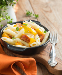 Pasta with cream sauce, italian sausage and pumpkin