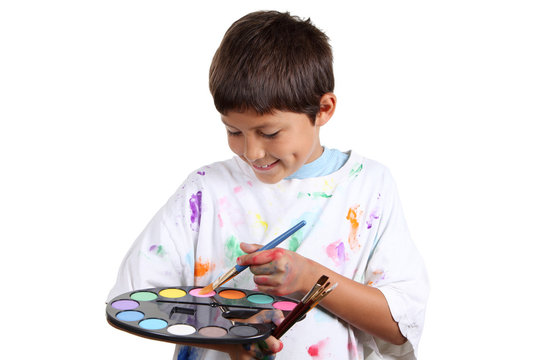 Young boy artist on white background