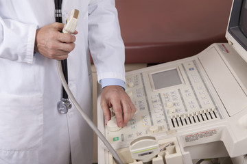 A professional sonographer uses an ultrasound machine.