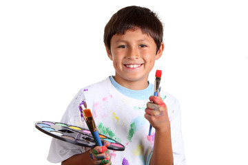 Young boy artist on white background