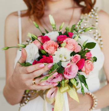 Bride holding wedding bouquet close up