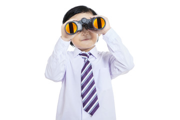 Close-up business kid holding binoculars - isolated