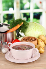 Ingredients for cooking borsch on table in kitchen