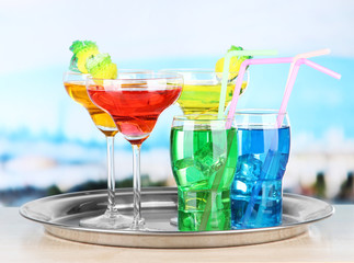 Different  colorful cocktails on bright background