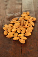 Almond on dark wooden background