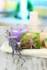 Obraz na płótnie Canvas Still life with lavender candle, soap, massage balls, bottles,