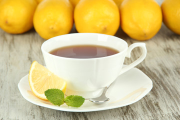 Obraz na płótnie Canvas Cup of tea with lemon on table close-up