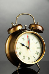 Old alarm clock  on gray background