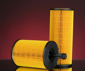 Car oil filters on dark color background