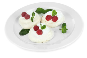 Tasty meringue cakes with berries, isolated on white
