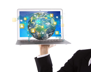 Business person holding Laptop with social network on earth (Ele
