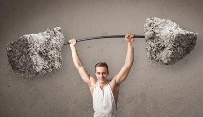 muscular man lifting large rock stone weights