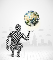 man in full body suit holding planet earth