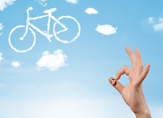 Happy smiley fingers looking at a bicycle shapeed cloud