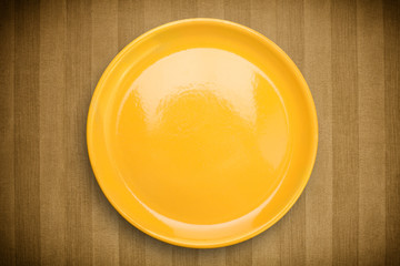 Colorful empty plate on grungy background table