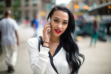 Young beautiful business woman in New York City - Powered by Adobe