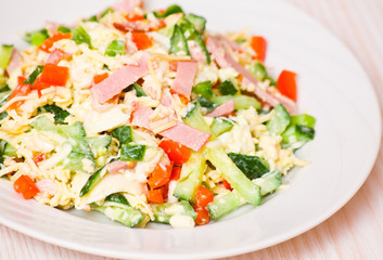 fresh salad with cheese, ham and vegetables
