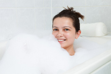 Happy woman in bathtub