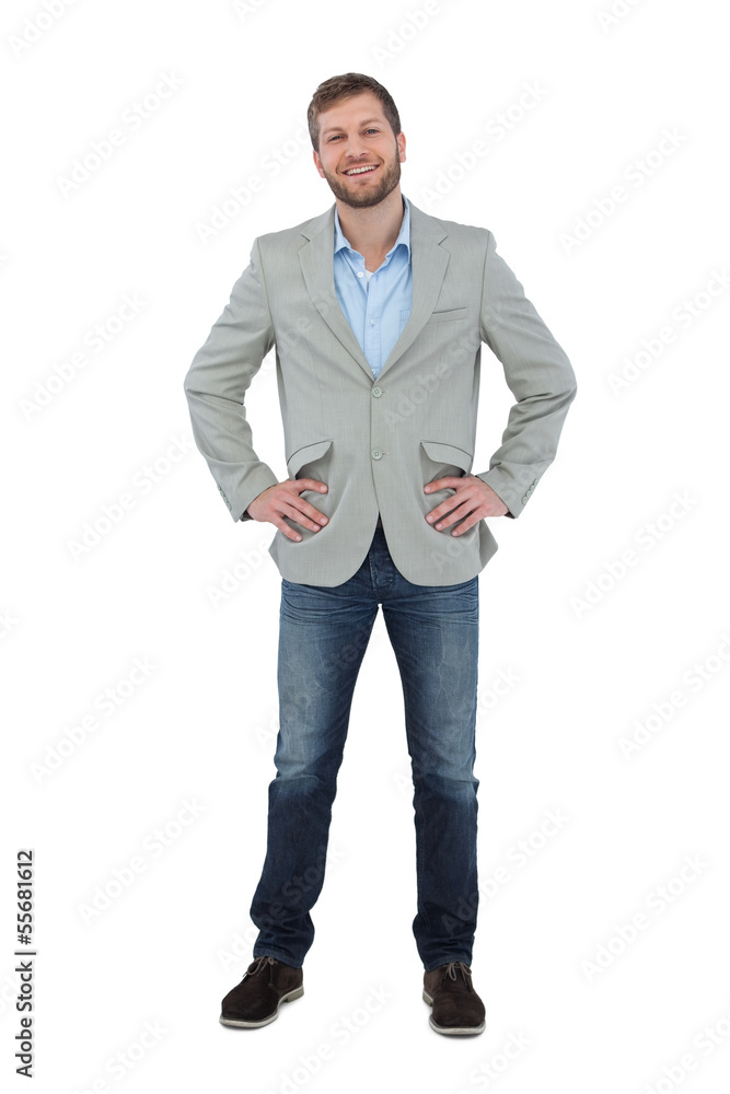Poster stylish man smiling with hands on hips looking at camera
